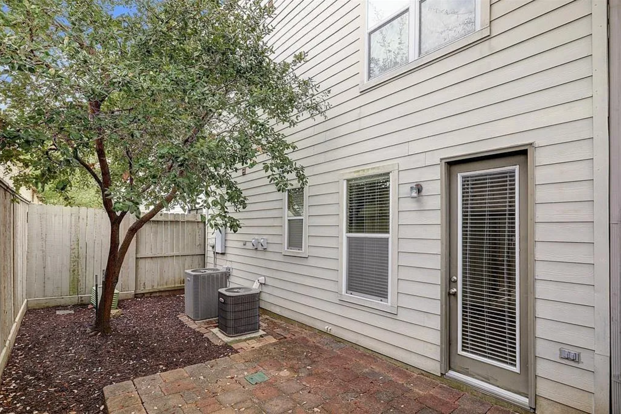 Outdoor space before — overlooked and undefined, failing to register as usable living area