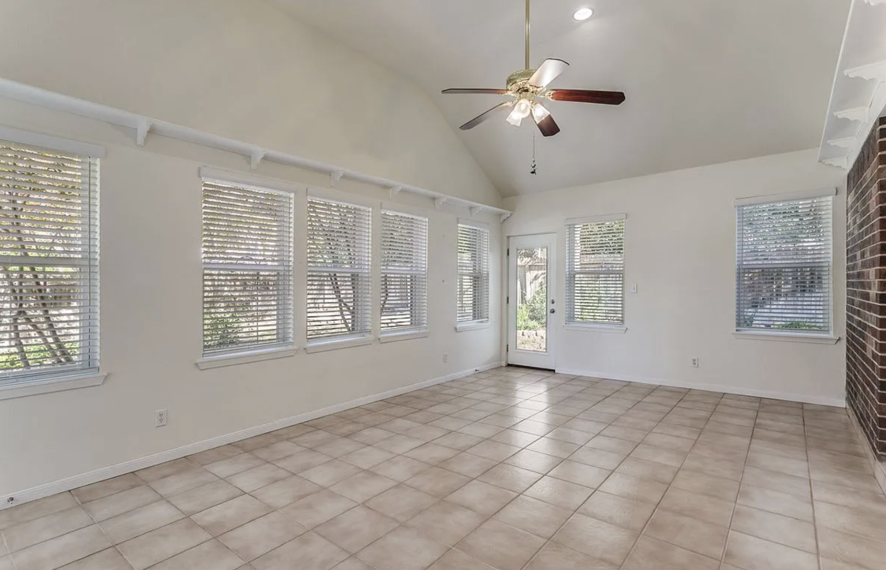 Large living area before — empty and cavernous, lacking warmth or defined gathering zones